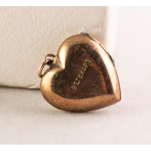 62 - SMALL ENGINE TURNED HEART SHAPED LOCKET PENDANT with 9ct GOLD BACK AND FRONT, 5/8in (1.5cm) high and... 