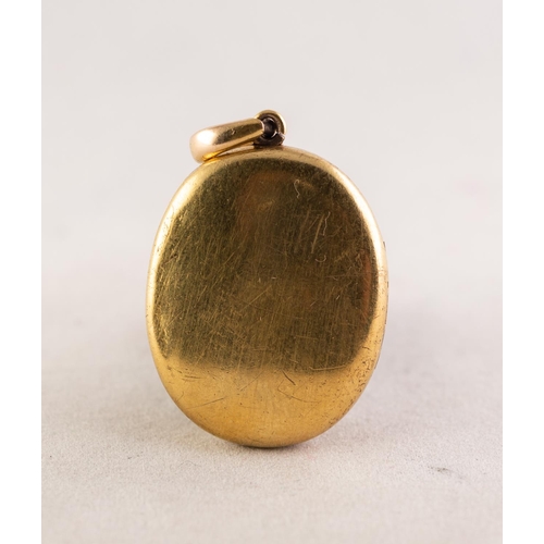 91 - VICTORIAN GOLD COLOURED EMTAL OVAL LOCKET PENDANT, the front applied with a horseshoe shaped setting... 