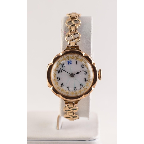 26 - RIVAL, LADY'S 9ct GOLD WRISTWATCH with 15 jewels movement, gilt decorated white porcelain Arabic dia... 