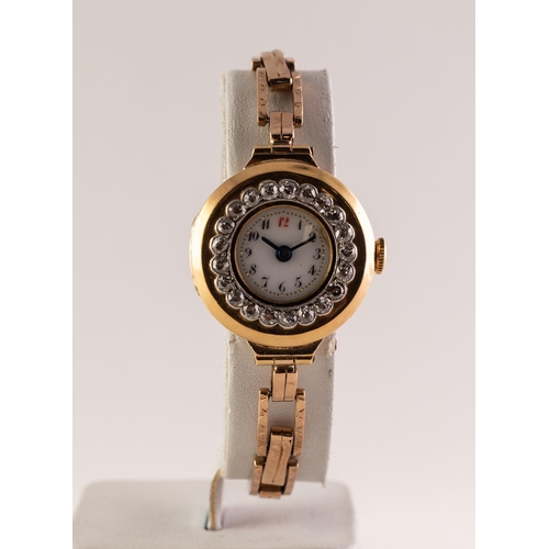 42 - EARLY 20th CENTURY 18ct GOLD CASED LADY'S WRISTWATCH with 15 jewel movement, the besel set with 21 t... 