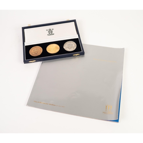 83 - ROYAL MINT CASED SET OF THREE COMMONWEALTH GAMES, MANCHESTER 2002, COMMEMORATIVE MEDALLIONS, VIZ gol... 