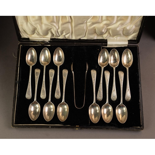 218 - GEORGE V CASED SET OF TWELVE SILVER TEASPOONS AND MATCHING PAIR OF SUGAR TONGS, with bright cut hand... 