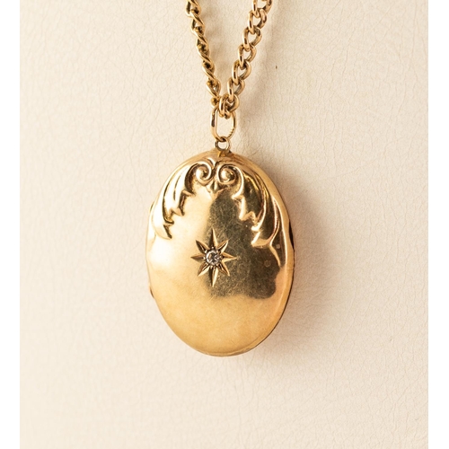79 - 9ct GOLD OVAL LOCKET set with a tiny diamond, on a 9ct GOLD CHAIN, 9.7 gms
