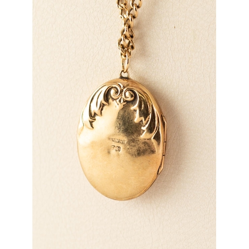 79 - 9ct GOLD OVAL LOCKET set with a tiny diamond, on a 9ct GOLD CHAIN, 9.7 gms