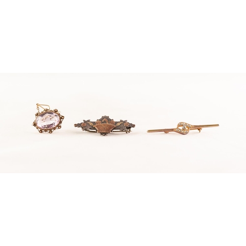 53 - INDISTINCTLY MARKED GOLD COLOURED METAL PALE AMETHYST SET BROOCH with safety chain; a late Victorian... 