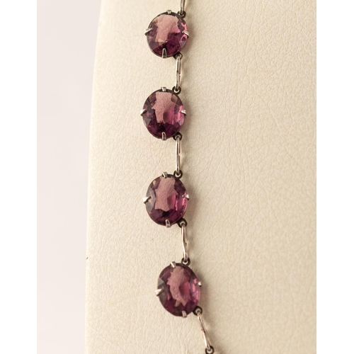 46 - SILVER COLOURED METAL 23 STONE AMETHYST SET NECKLACE
