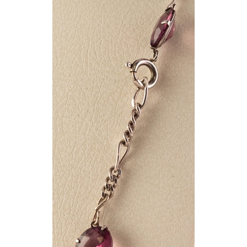 46 - SILVER COLOURED METAL 23 STONE AMETHYST SET NECKLACE