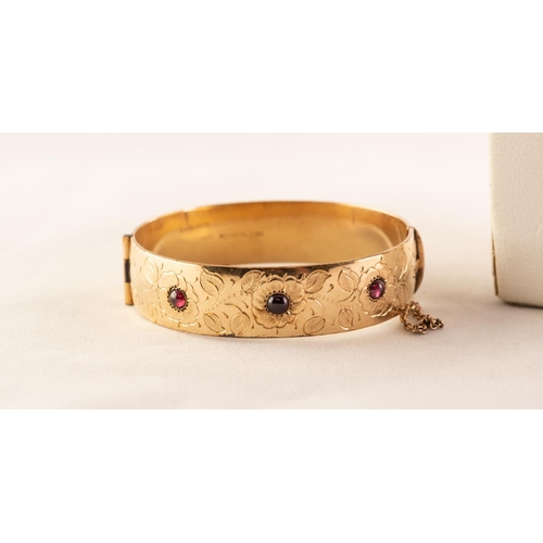 40 - GOLD PLATED ON METAL CORE RED CABOCHON STONE SET STIFF BANGLE and a silver CHAIN (2)