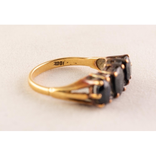 41 - 18ct GOLD RING set with three dark sapphires divided with four tiny diamonds, 4.1 gms