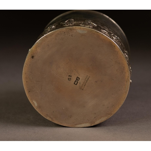 228 - GEORGE V EMBOSSED SILVER TEA CADDY RETAILED BY FINNIGANS OF MANCHESTER, of cylindrical form with pul... 