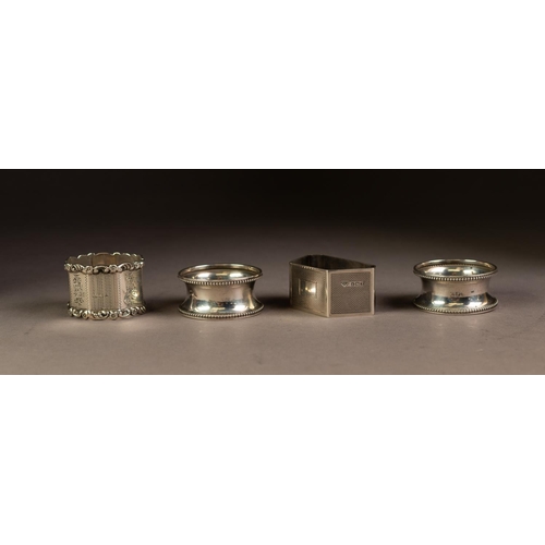 223 - FOUR SILVER NAPKIN RINGS, comprising: A PAIR, Birmingham 1923, ANOTHER, octagonal, marks rubbed and ... 