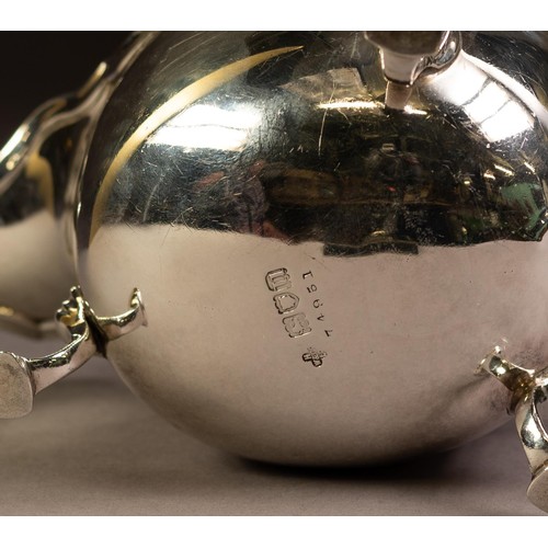 207 - GEORGIAN STYLE SILVER SAUCE BOAT, oval with moulded wavy edge, free scroll handle, raised on three h... 