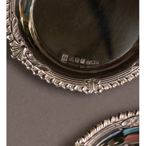 185 - SET OF SIX IRISH SILVER COASTERS WITH SPECIAL SWORD OF LIGHT HALLMARK, each with plain centre and sh... 