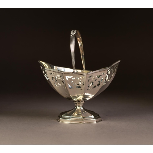 193 - LATE VICTORIAN SWING HANDLED PEDESTAL SUGAR BASKET, of panelled oval form with reeded handle and con... 