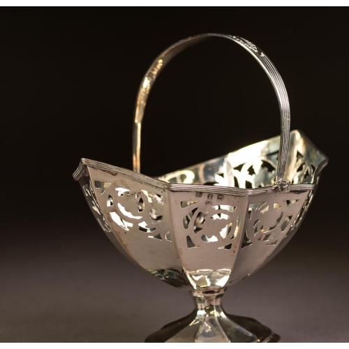 193 - LATE VICTORIAN SWING HANDLED PEDESTAL SUGAR BASKET, of panelled oval form with reeded handle and con... 