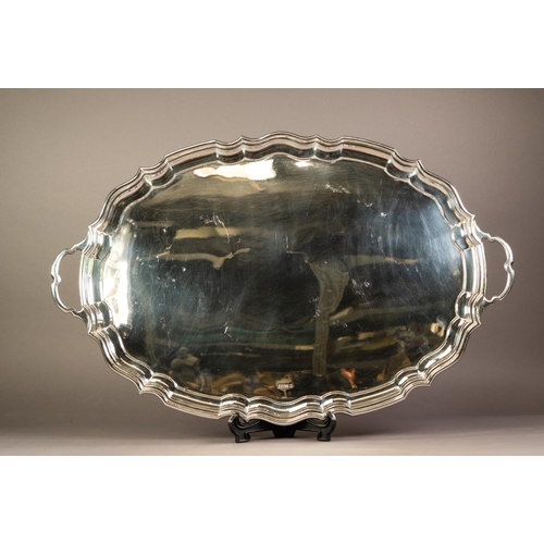 179 - GEORGE V SILVER LARGE TWO HANDLED TEA TRAY BY CHARLES BOYTON & SON, of oval form with plain cent... 