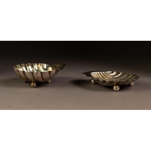 201 - TWO SIMILAR EARLY TWENTIETH CENTURY SILVER SHELL PATTERN BUTTER DISHES both with ball feet, Sheffiel... 