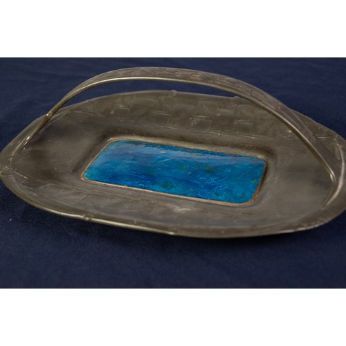 33A - ARCHIBALD KNOX FOR LIBERTY, ENAMELLED PEWTER CAKE BASKET, of rounded oblong form with central strap ... 