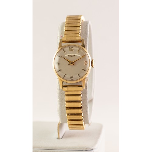 18 - LADY'S TISSOT 14ct GOLD SWISS WRISTWATCH, with mechancial movement, silvered dial with four arabic n... 