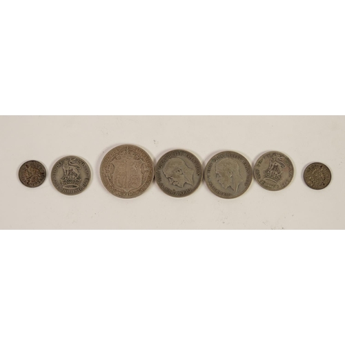 99 - SELECTION OF SEVEN GEORGE V SILVER COINS to include; 1918 half crown (VF), TWO FLORINS, TWO ONE SHIL... 