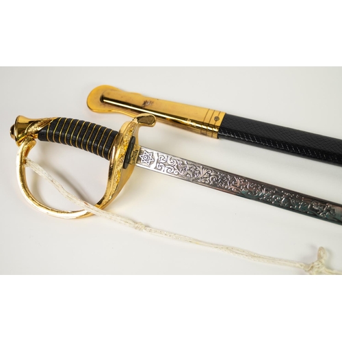 112 - MODERN REPRODUCTION SWORD IN GILT METAL AND SIMULATED LEATHER, the curved clade with United States M... 