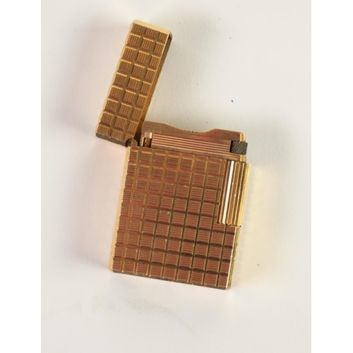 181 - S.T. DUPONT GILT METAL POCKET CIGARETTE LIGHTER, all-over cut square trellis pattern, the base numbe... 