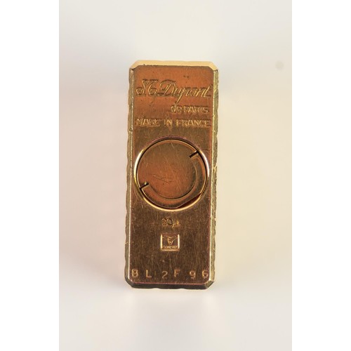 181 - S.T. DUPONT GILT METAL POCKET CIGARETTE LIGHTER, all-over cut square trellis pattern, the base numbe... 