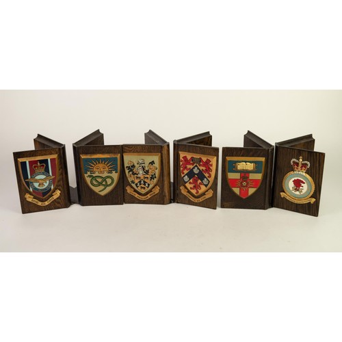 115 - THREE PAIRS OF MID TWENTIETH CENTURY OAK BOOK FORM BOOK ENDS, EACH APPLIED WITH PAINTED MILITARY CRE... 