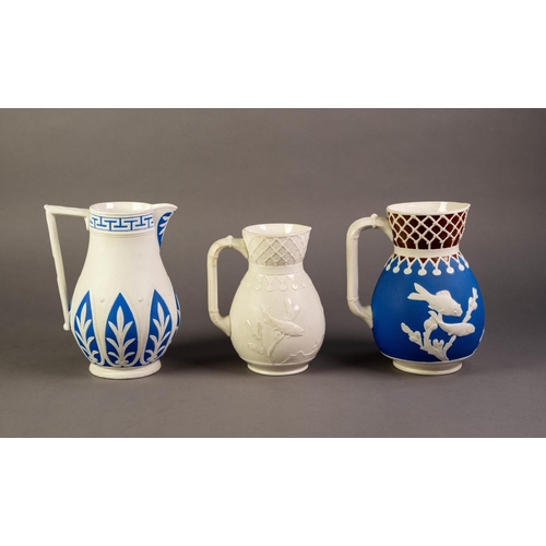 14 - WILLIAM BROWNFIELD OR ATTRIBUTED TO, TWO NINETEENTH CENTURY RELIEF MOULDED POTTERY JUGS IN BLUE AND ... 