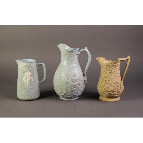 16 - WILLIAM BROWNFIELD OR ATTRIBUTED TO, THREE NINETEENTH CENTURY RELIEF MOULDED POTTERY JUGS IN COLOURE... 