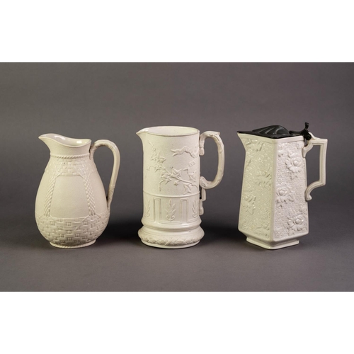 18 - WILLIAM BROWNFIELD OR ATTRIBUTED TO, THREE NINETEENTH CENTURY RELIEF MOULDED POTTERY JUGS GLAZED IN ... 