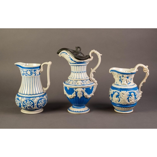 20 - CHARLES MEIGH OR ATTRIBUTED TO, THREE NINETEENTH CENTURY RELIEF MOULDED POTTERY JUGS IN BLUE AND WHI... 