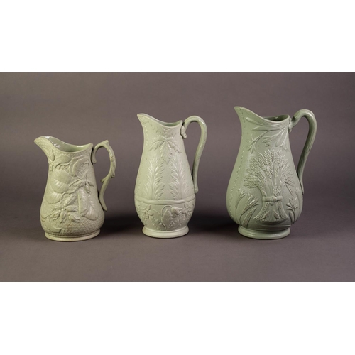 30 - DUDSON OR ATTRIBUTED TO, THREE NINETEENTH CENTURY RELIEF MOULDED AND GREEN GLAZED POTTERY JUGS, one ... 