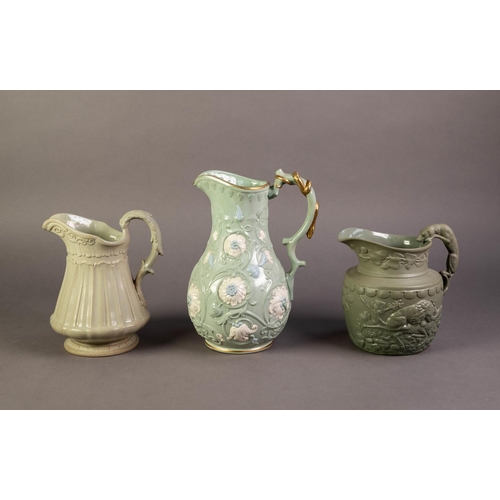 42 - RIDGWAY OR AFTER, THREE RELIEF MOULDED AND PALE GREEN GLAZED POTTERY JUGS, one modelled in the ‘chry... 