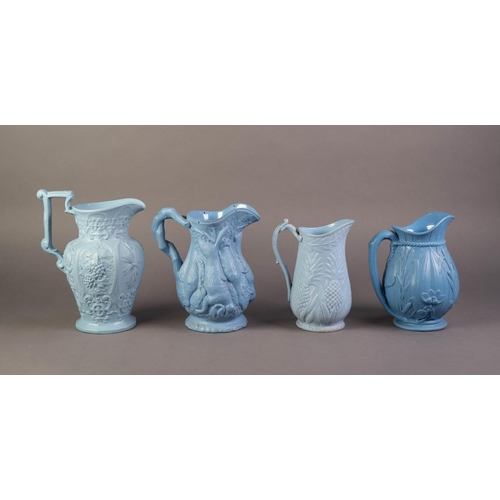 61 - FOUR UNATTRIBUTED NINETEENTH CENTURY BLUE GLAZED AND RELIEF MOULDED POTTERY JUGS, comprising, one MO... 