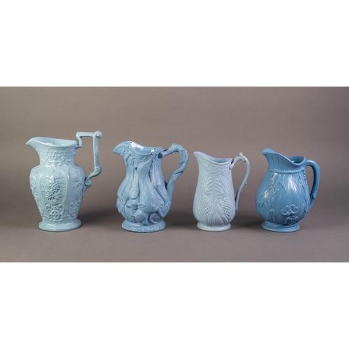 61 - FOUR UNATTRIBUTED NINETEENTH CENTURY BLUE GLAZED AND RELIEF MOULDED POTTERY JUGS, comprising, one MO... 