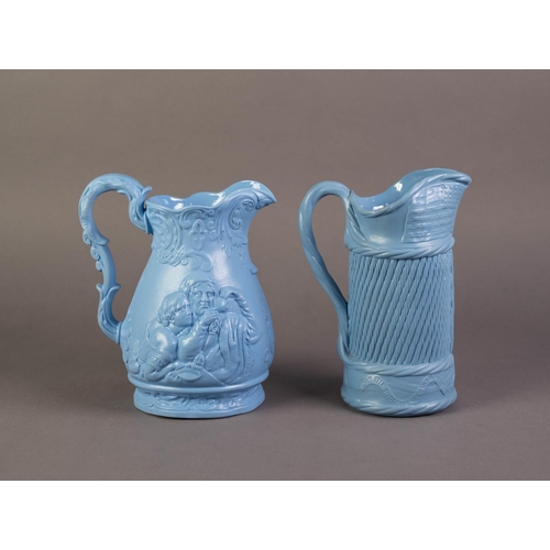 67 - TWO UNATTRIBUTED NINETEENTH CENTURY BLUE GLAZED AND RELIEF MOULDED POTTERY JUGS, one PRODUCED TO COM... 