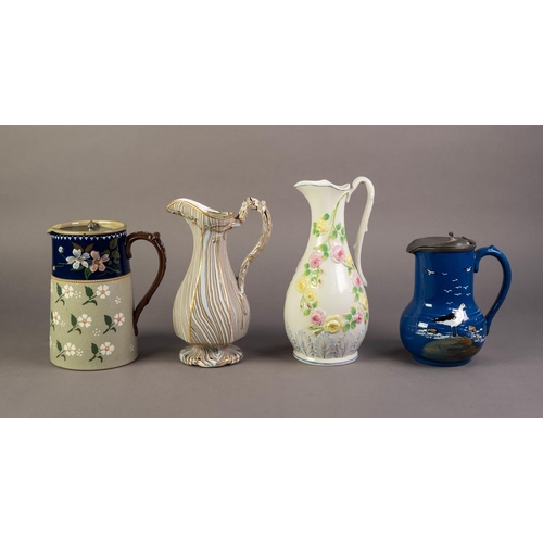 82 - THREE UNATTRIBUTED NINETEENTH CENTURY POTTERY JUGS, comprising: ONE GLAZED AS AGATE, HEIGHTENED IN G... 