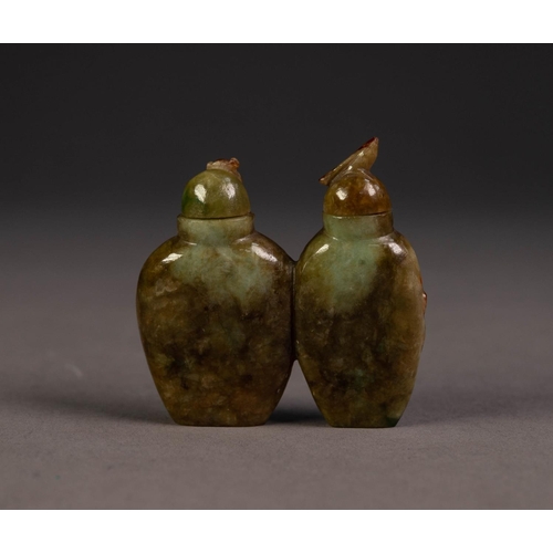 202 - TWO CHINESE GREEN AND BROWN JADE CONJOINED SNUFF BOTTLES AND STOPPERS, ovular, the fronts carved in ... 