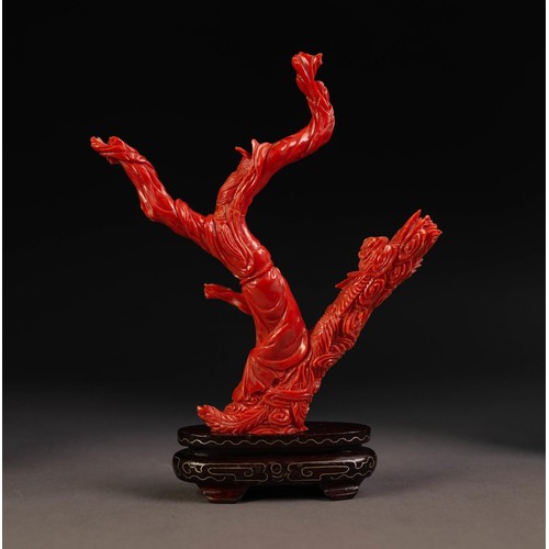 208 - ORIENTAL CARVED RED CORAL DEPICTING A FEMALE FIGURE in flowing robes and a phoenix flying amidst clo... 