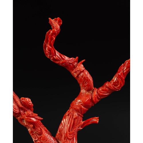 208 - ORIENTAL CARVED RED CORAL DEPICTING A FEMALE FIGURE in flowing robes and a phoenix flying amidst clo... 