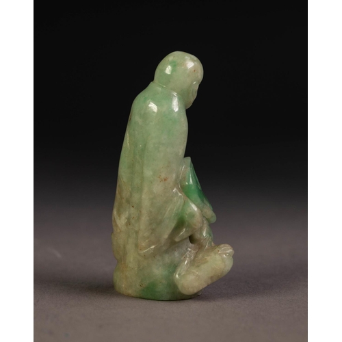 211 - CHINESE SHADED PALE GREEN CARVED JADE FIGURE of a deity standing with a small animal at his feet, 2 ... 