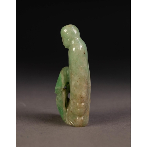 211 - CHINESE SHADED PALE GREEN CARVED JADE FIGURE of a deity standing with a small animal at his feet, 2 ... 