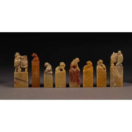 222 - SIX CHINESE CARVED SOAPSTONE RECTANGULAR SEALS each with a Dog of Fo surmounting and two with man re... 