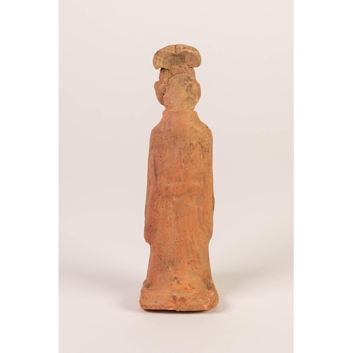 194 - AGED CHINESE TERRA COTTA FIGURE OF AN IMMORTAL, his hands clasped before him, a tortoise ascending f... 