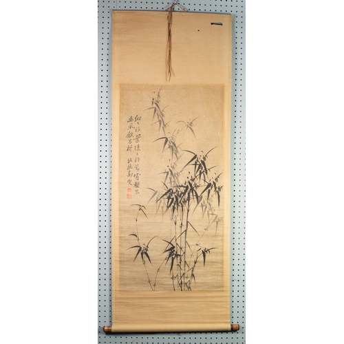 225 - THREE CHINESE MONOCHROME SCROLL PAINTINGS, one depicting bamboo, another of a tranquil village setti... 