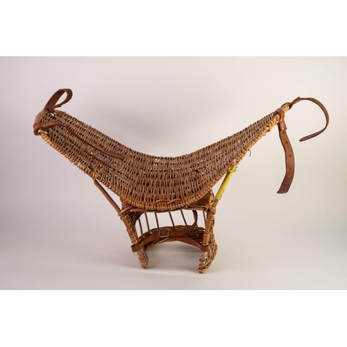 126 - CHILD’S WOVEN WICKER BASKET SADDLE, with brown leather fittings