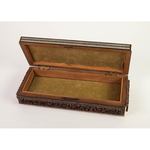 32 - EARLY TWENTIETH CENTURY INDIAN CARVED HARDWOOD AND IVORY INLAID OBLONG BOX, the hinge top with well ... 