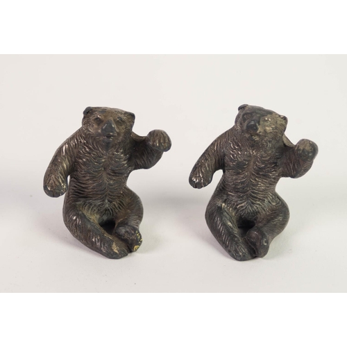 8 - TWO INDENTICAL CAST LEAD INFANT'S RATTLES, in the form of seated bears 2 in (5cm) high