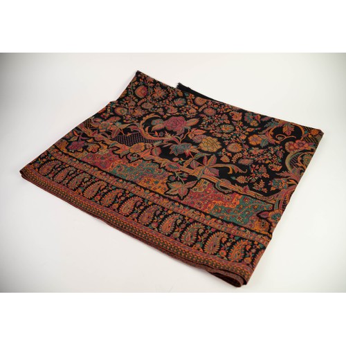 70 - WOVEN SILK AND WOOL PAISLEY SHAWL, the central ground filled with naturalistic flowers and scrolls o... 